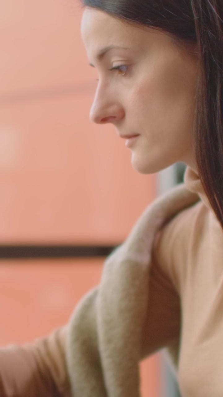 Focused Woman Using Digital Stylus on Tablet in Modern Office