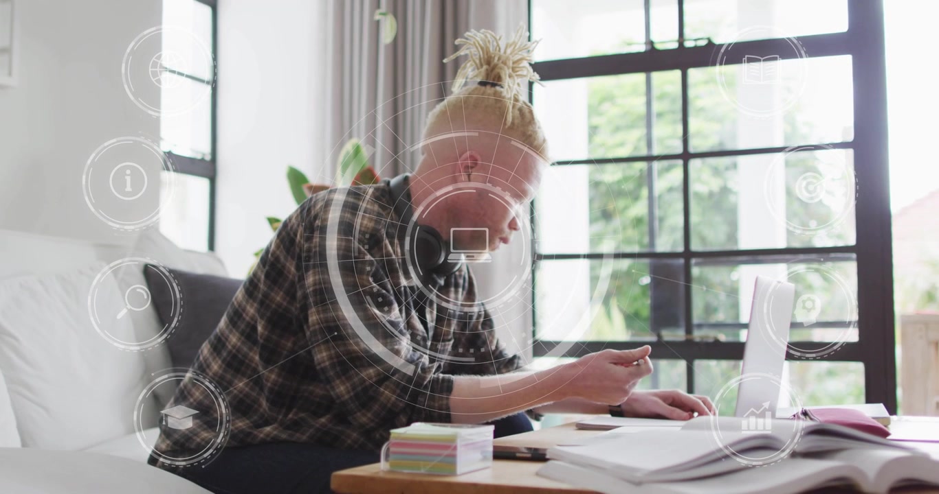 Man pressing laptop trackpad and writing notes, starting floating tech graphics for data capture