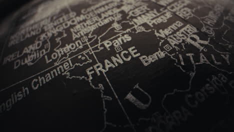 close-up of a vintage world globe focusing on france