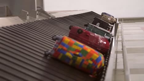 luggage on a carousel in an airport