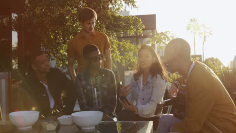 group of friends discussing on a rooftop