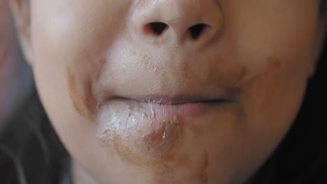 child eating chocolate