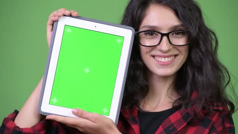 young beautiful businesswoman showing digital tablet
