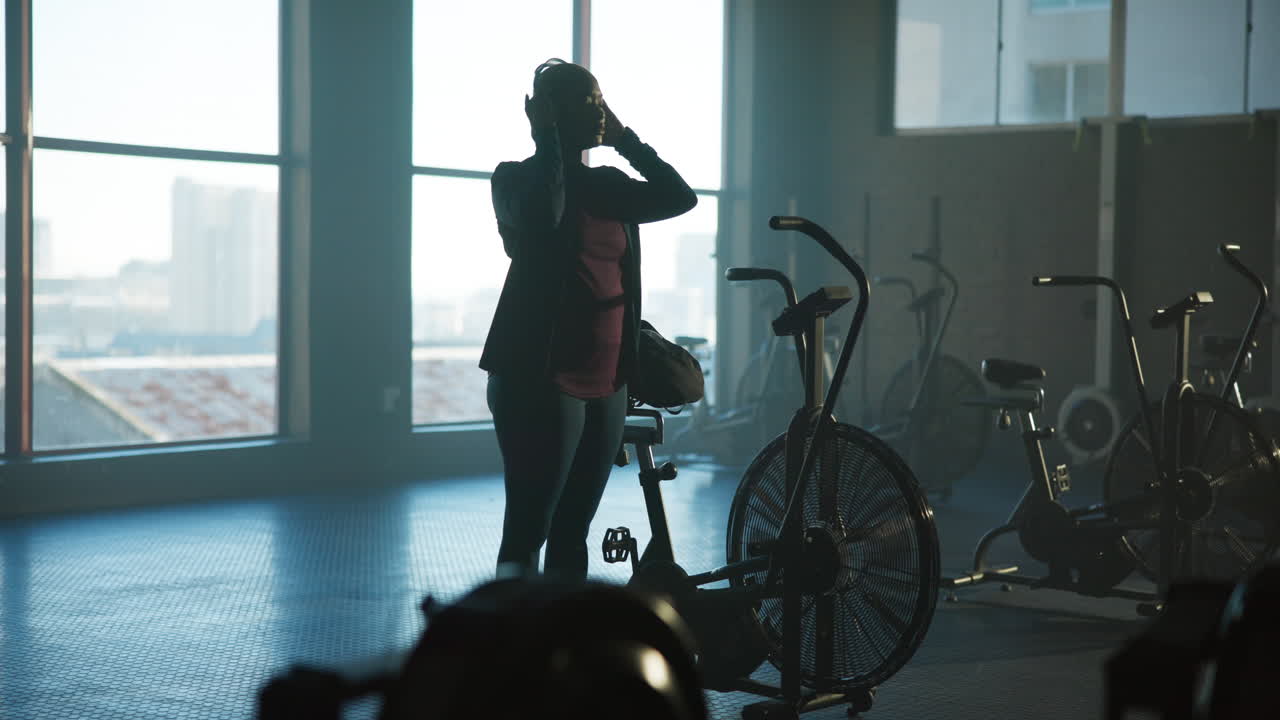 Woman in Gym with Exercise Bike