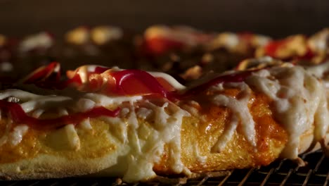 close-up of a ring-shaped pizza on a cooling rack