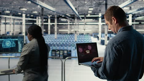 engineer in server room receives critical error popup on laptop screen