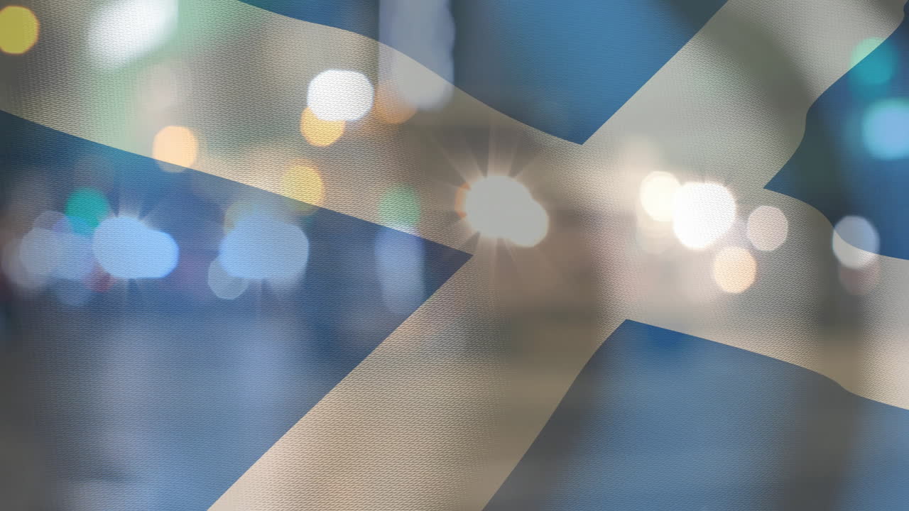 Animating Scottish flag over blurred city lights background
