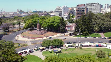 Aerial-orbit-of-the-Recoleta-neighborhood-and-the-equestrian-monument-to-Carlos-María-de-Alvear,-sunny-day-with-low-traffic