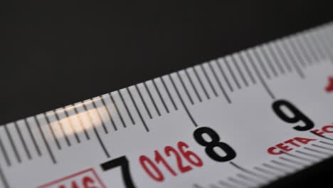 tape measure. sliding shot with nice depth of field. macro shot. close up.