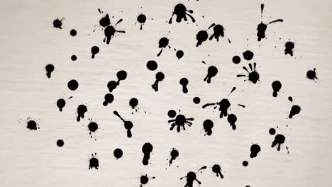 abstract black ink splatters and dots on textured background
