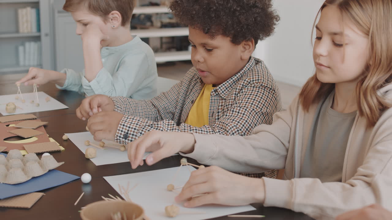 Children Making Crafts with Plasticine and Toothpicks
