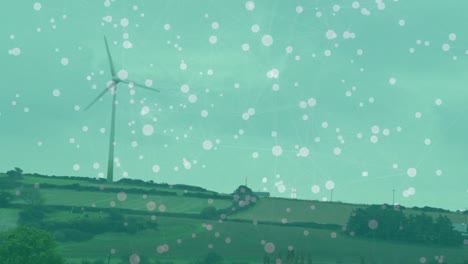Animation-of-network-of-connections-over-spinning-windmill-on-grassland-against-sky