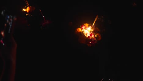 nighttime ceremony with flowers and candles