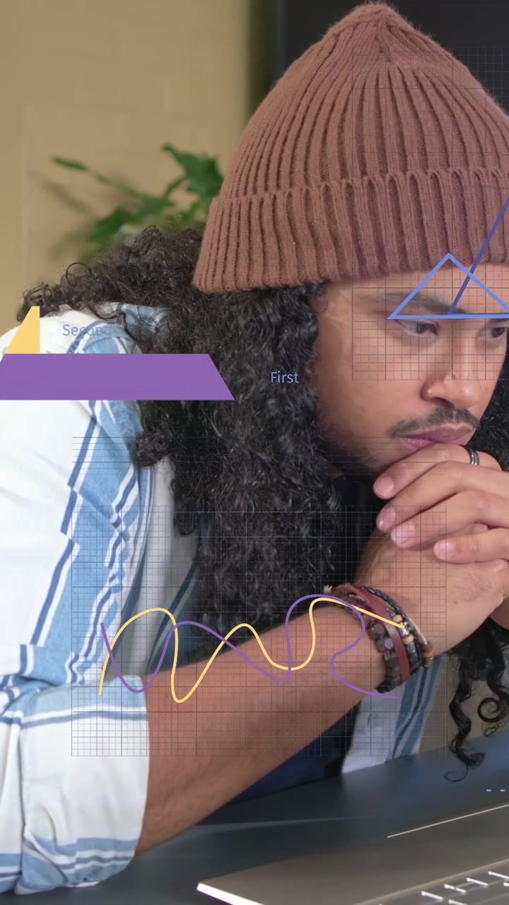 Vertical video: Man typing on laptop, launching motion charts, sipping mug, analyzing business data
