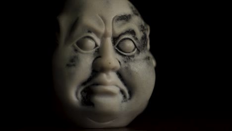 close-up of a stylized japanese head sculpture