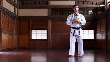 karate athlete receiving a gold medal