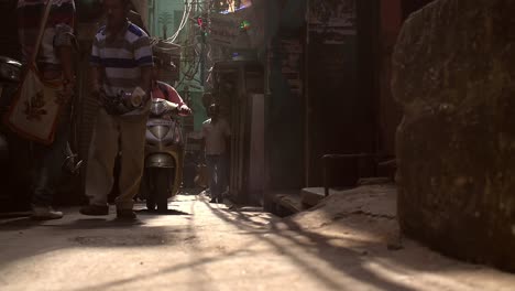 Man-Cleaning-Dirty-Alleyway