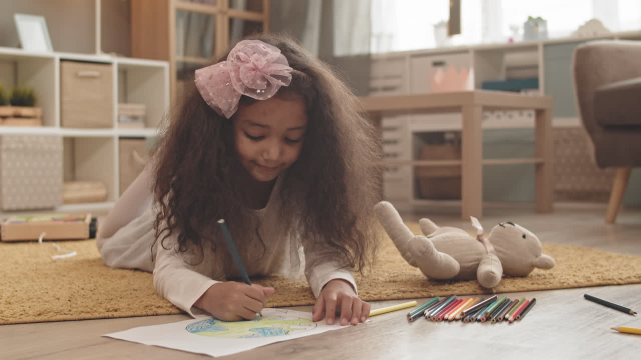 Girl Lying on Floor Drawing