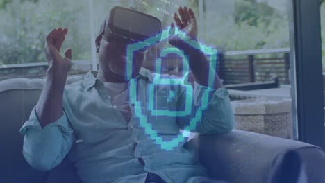 animación del icono del candado y procesamiento de datos sobre un hombre afroamericano usando auriculares vr