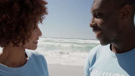 volunteers interacting with each other on the beach 4k