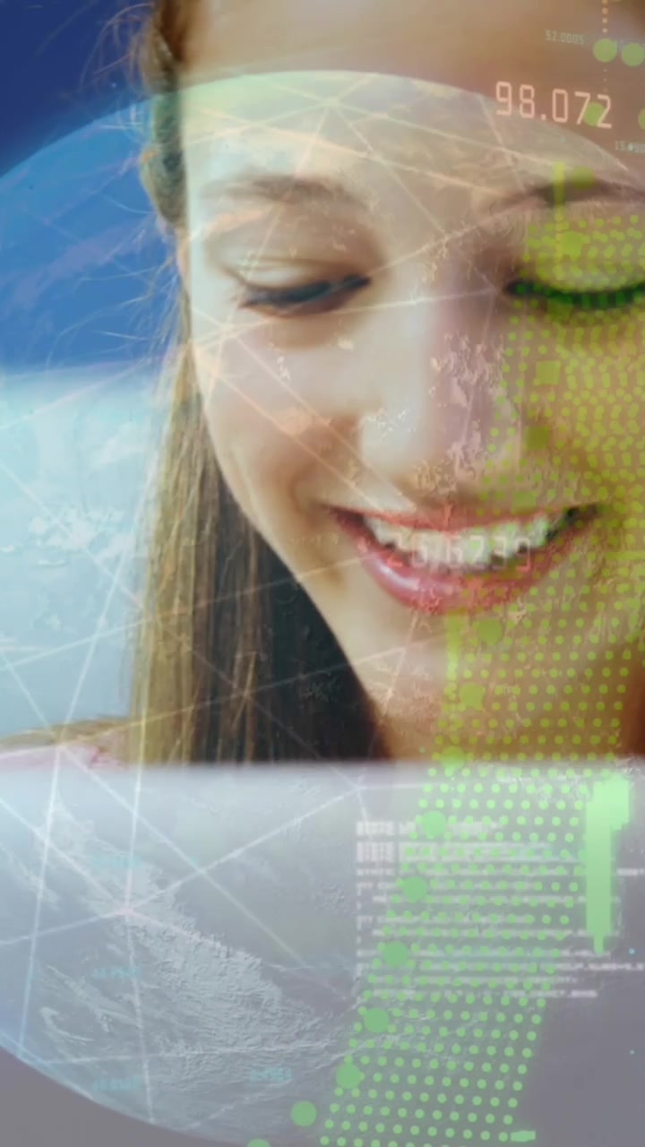 Animation of data processing over diverse girl and boy using digital tablet and smiling at school