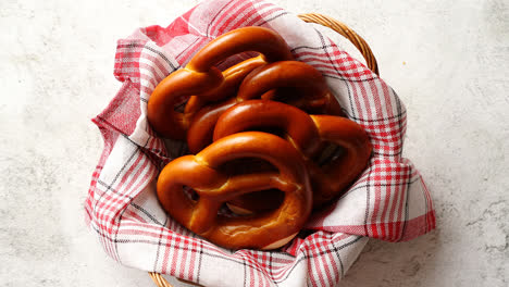 Basket-with-red-and-white-checkered-napkin-filled-with-fresh-brown-pretzels