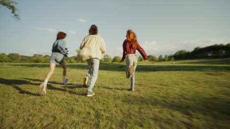 friends running through a park