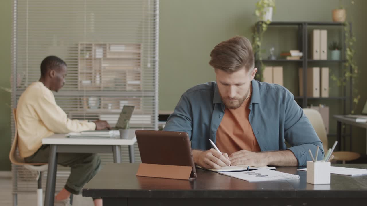 Businessman Working on Tablet PC in Office