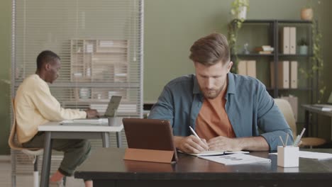 businessman working on tablet pc in office