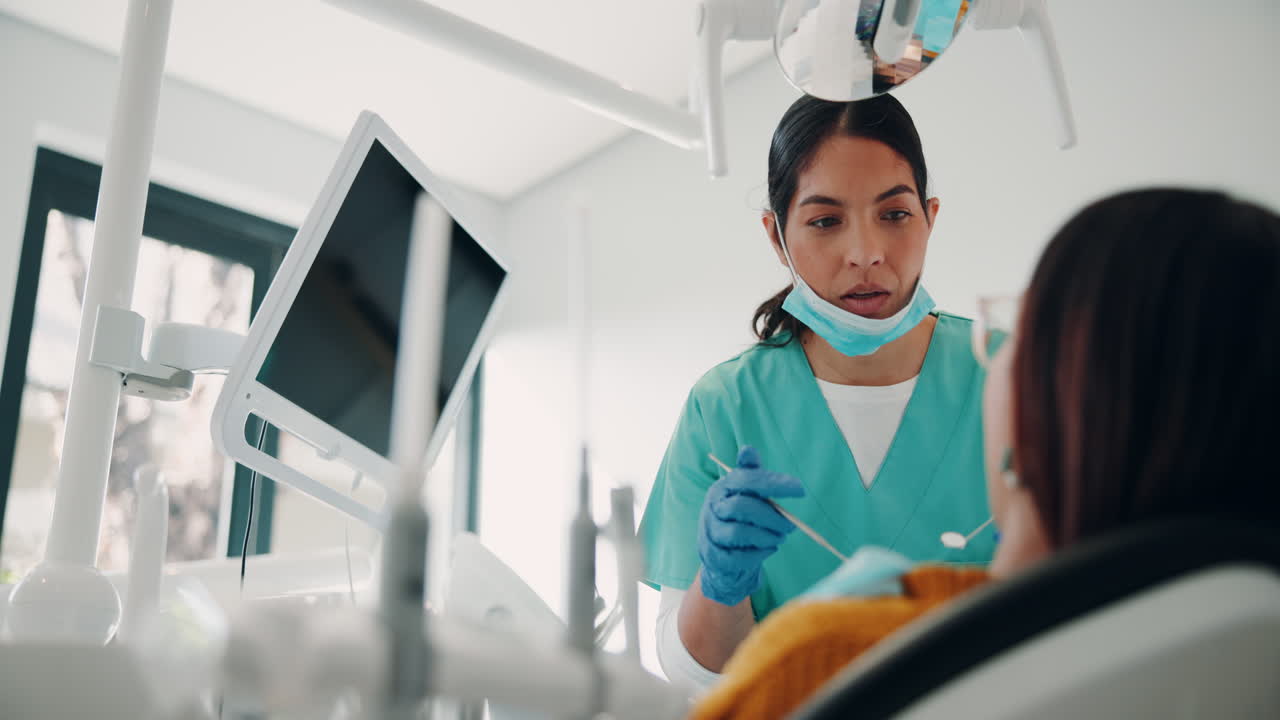 A dentist examining a patient's teeth