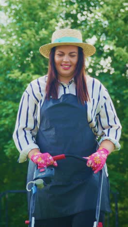 joyful gardener in action: embracing nature's beauty with a mower, showcasing gardening skills and passion for plant care in a lush green setting