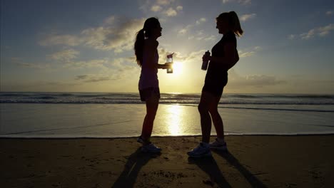 ethnic american females relaxed and resting after exercise