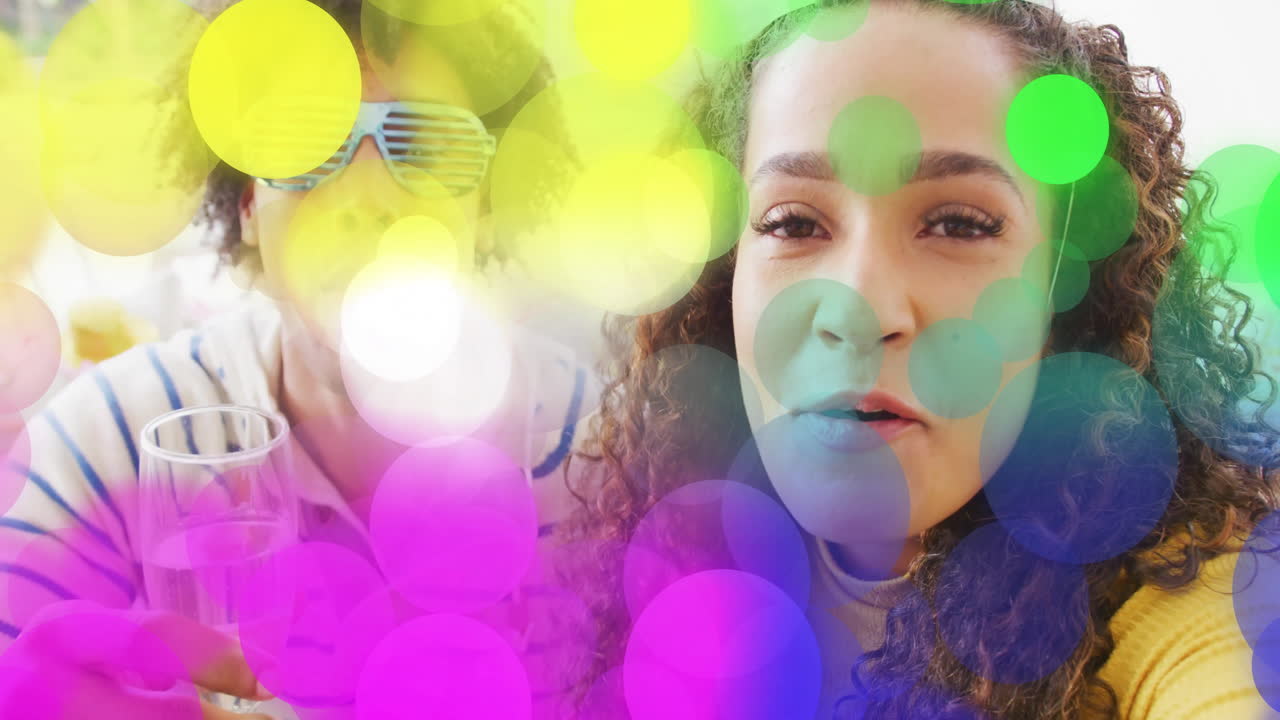 Celebrating with drinks, people enjoying colorful bokeh lights animation