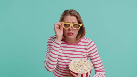 woman in 3d glasses eating popcorn and watching interesting tv serial, sport game film, online movie