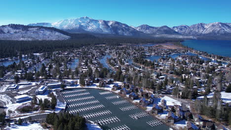 Tahoe-Keys-and-Lake-Tahoe,-California-USA,-Aerial-View-of-Marina-and-Houses-in-Canals-on-Sunny-WInter-Day