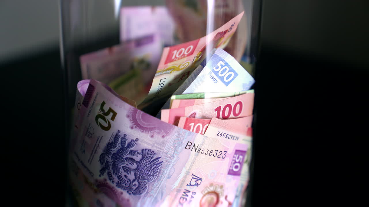 Mexican Pesos in a Glass Jar