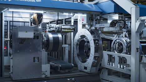 tyre manufacturing factory storage with background worker in face mask working