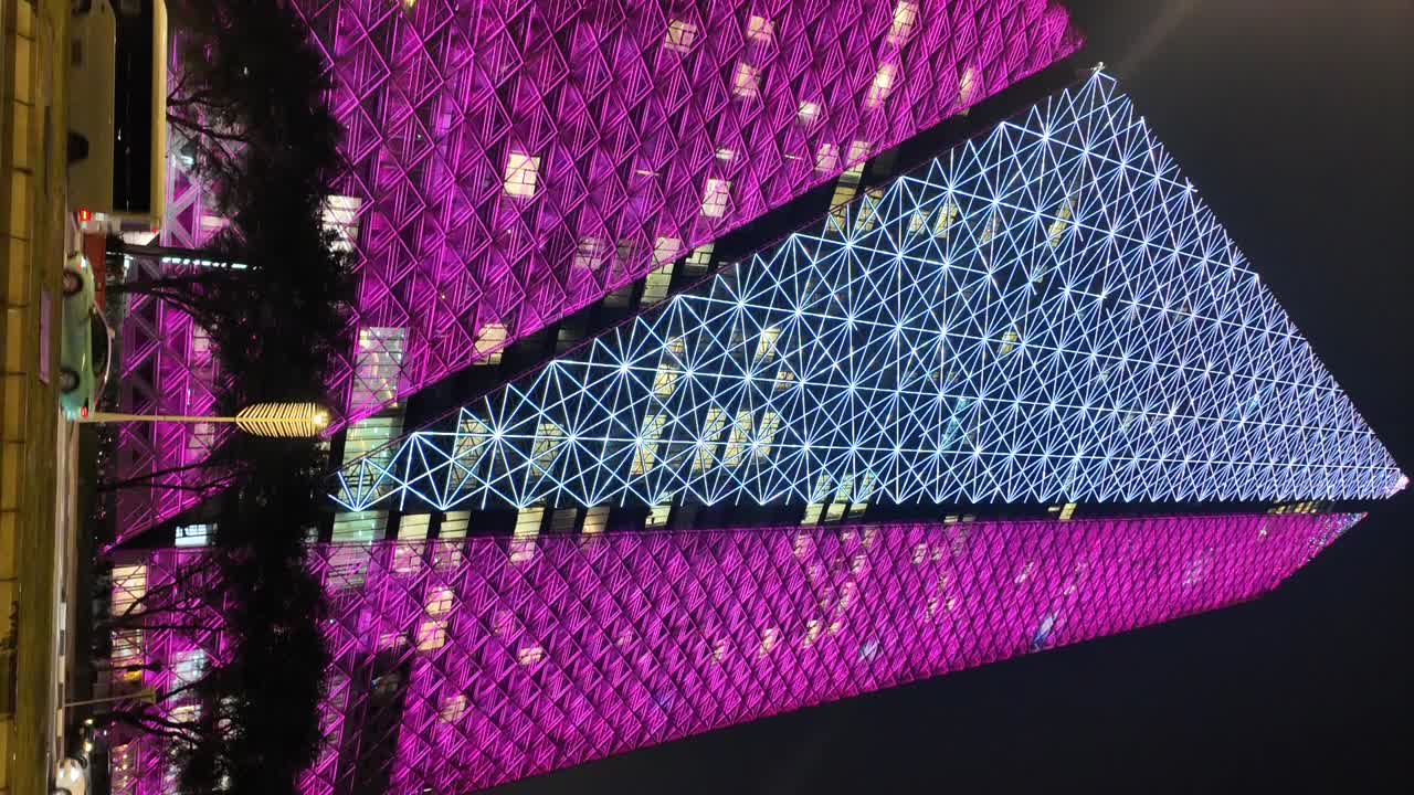 Pink and Purple Illuminated Skyscraper at Night