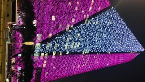 pink and purple illuminated skyscraper at night