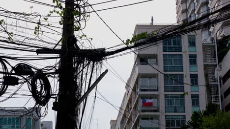 National-flag-of-Chile-displayed-outside-a-window-of-a-condominium-in-Sukhumvit-30,-Soi-Philippine,-Bangkok,-Thailand