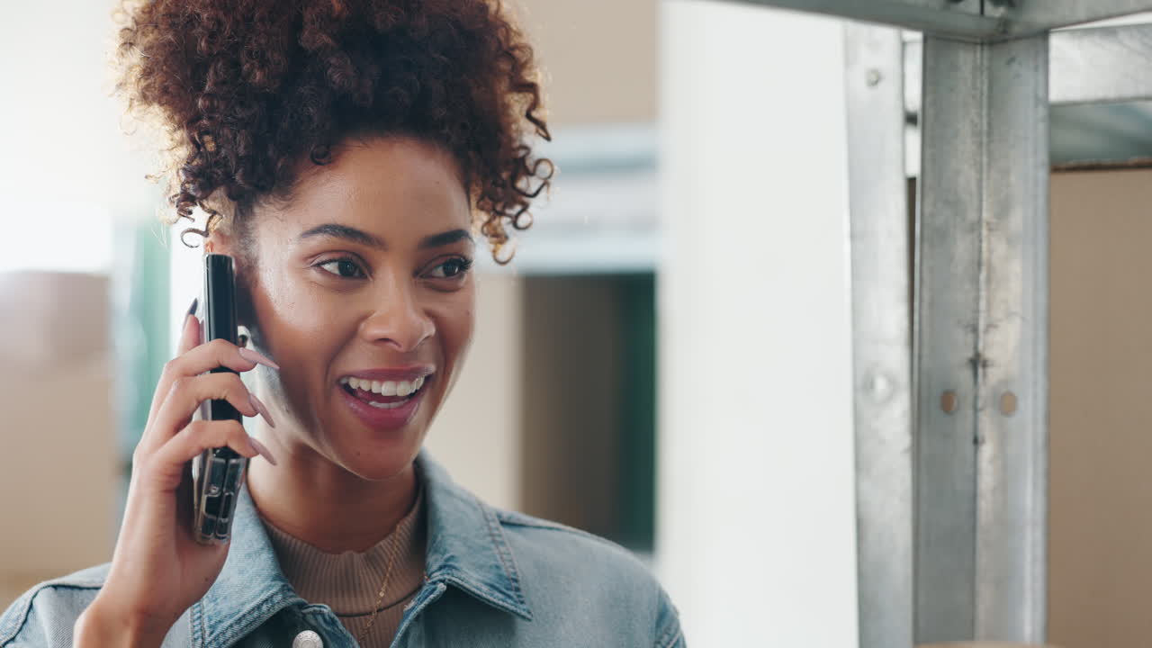 Woman talking on phone in new apartment