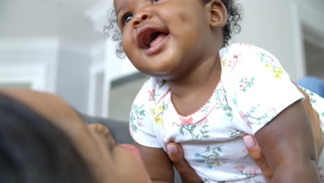 Slow-Motion-Shot-Of-Mother-Playing-With-Daughter-At-Home