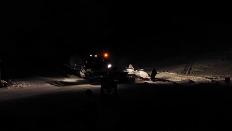 Heavy-industrial-machinery,-nighttime-environment,-ski-slope-preparation