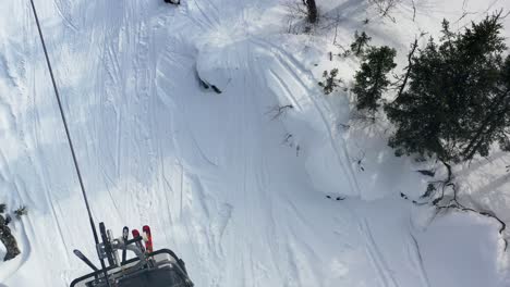 ski resort aerial view with ski lift and snow covered trails