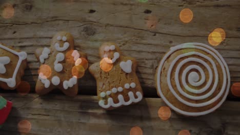 animation of christmas gingerbread cookies on wooden background