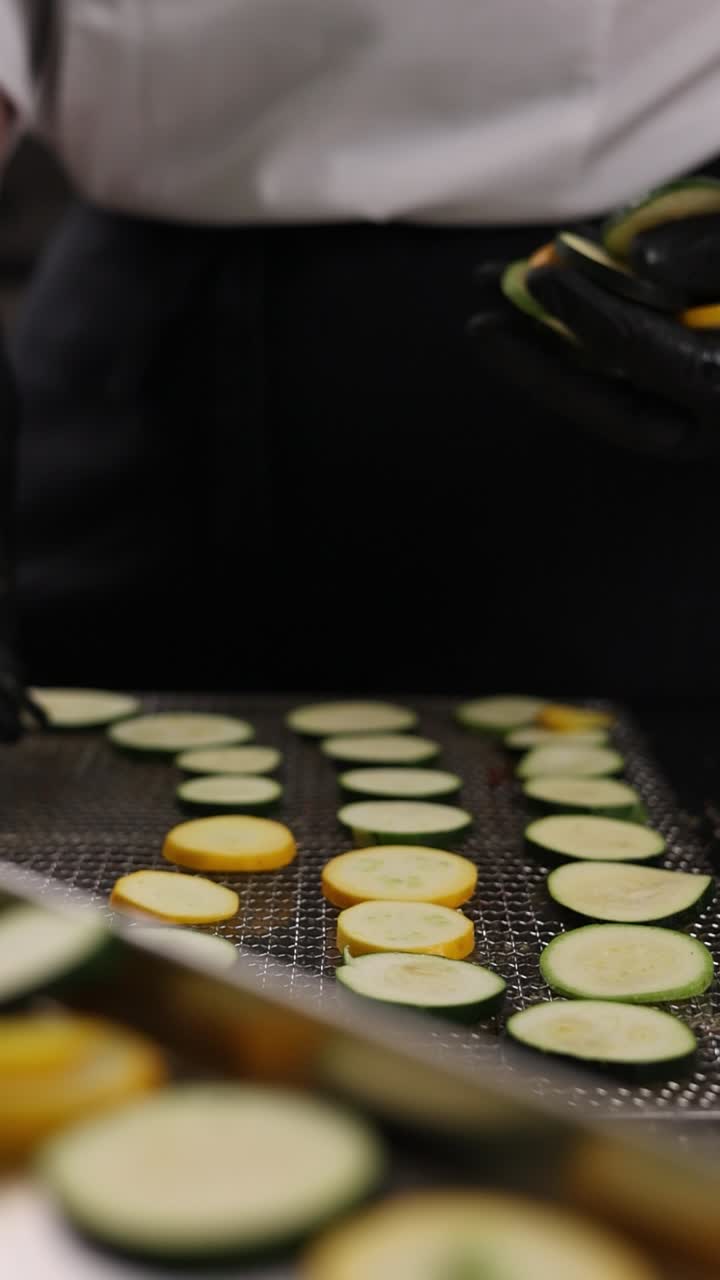 Chef Preparing Sliced Zucchini and Yellow Squash