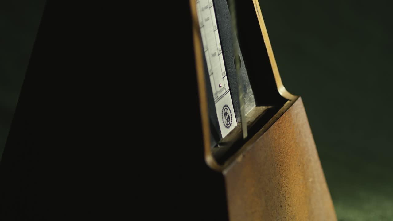 Wind-up Clockwork Metronome pendulum rhythmic tempo beat action MACRO