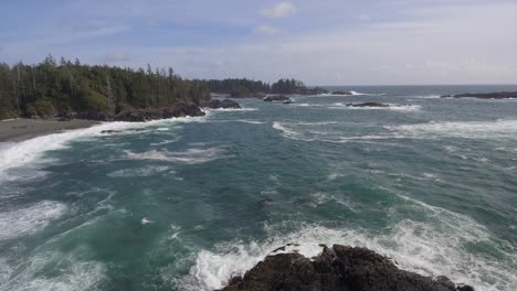 Aerial-shot-of-the-ocean-waves-along-the-shore-