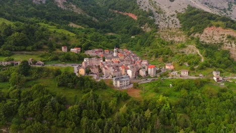 drone captures the tranquil beauty of casso, a small village surrounded by the dramatic peaks of the dolomites.