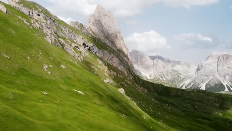 Secede-peak-in-Dolomites-of-Italy,-sunny-vibrant-day-aerial-view